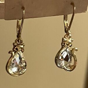 CAT earrings polished gold tone metal pear shape crystal body.